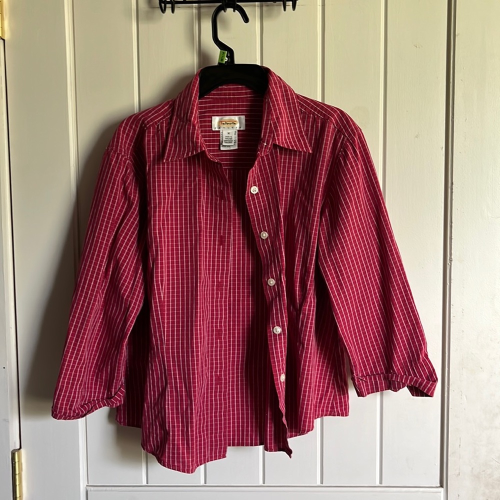 Half sleeve button up maroon shirt. White stripes with white buttons.